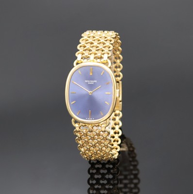 PATEK PHILIPPE Ellipse Armbanduhr in GG 750/000 Referenz 3848/1, Schweiz um 1980, Handaufzug, ovales 3-tlg. Geh., orig. Goldband, Boden u. Glasrand ...