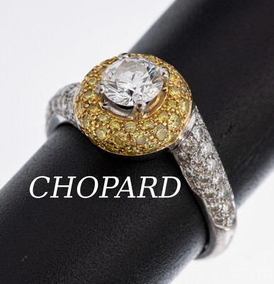 18 kt Gold CHOPARD Brillant Ring, WG/GG 750/000, mittig mit einem Brillant ca. 0.50 ct feines Weiß/vvs, umgeben von in GG gefassten 44 gelben ...