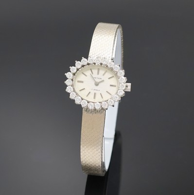 METEOR Damenarmbanduhr in WG 585/000 mit Diamantlünette, Handaufzug, Deutschland um 1965, Boden aufgedr., Lün. aufw. m. Diamanten bes., silb. ...