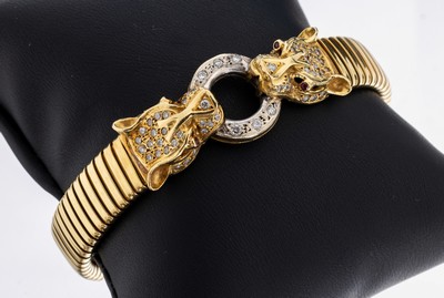 18 kt Gold Rubin-Brillant-Armreif "Raubtier", GG/WG 750/000, 4 rundfacett. Rubine als Augen zus. ca. 0.04 ct, 1 Stein fehlt, 66 Brillanten ...