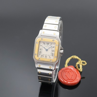 CARTIER Santos Armbanduhr in Edelstahl/Gold Referenz 1057930, Schweiz um 1990, quarz, Boden 8-fach verschr., Schmuckkrone (Stein fehlt), orig. ...
