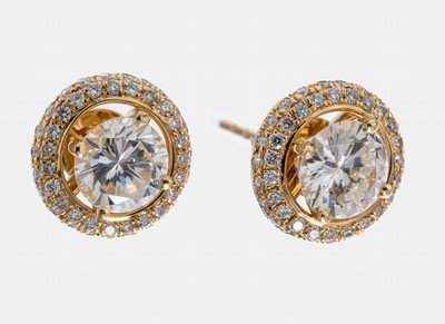 Paar 18 kt Gold Brillant-Ohrstecker, GG 750/000, 2 Brillanten zus. ca. 1.06 ct Weiß- l.get.Weiß/vs, umgeben von einem abnehmbaren Brillant-Kranz ...