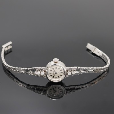 FORMATIC Damenarmbanduhr in WG 585/000, Schweiz um 1960, Handaufzug, 2-teil. Geh. inkl. Goldband m. 6 Diamanten u. Klappschl., Boden aufgedr., silb. ...