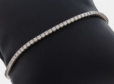 14 kt Gold Brillant-Linienarmband, WG 585/000, 85 Brillanten zus. ca. 1.70 ct Weiß/si-p1, L. ca. 19.5 cm, Kastenschloss mit Sicherheitsacht, ca. ...