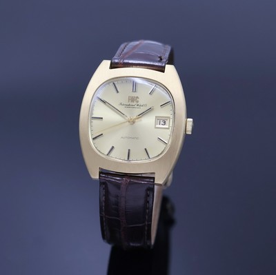 IWC schwere Herrenarmbanduhr in GG 750/000, Schweiz um 1970, Automatik, 2-tlg. Geh., Boden verschr., orig. Krone, gold. Zifferbl., gold.Indizes u. ...
