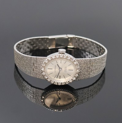 LIVANO Damenarmbanduhr in WG 585/000 mit Diamanten, Schweiz um 1965, Handaufzug, Goldband, Boden aufgedr., Lünette aufw. m. Diamanten bes., silb. ...