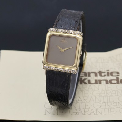 BAUME & MERCIER Armbanduhr in GG 750/000 m. Diamanten, Schweiz verk. lt. beil. Garantie 02/1988, Handaufzug, Boden aufgedr., Lederband m. orig. verg. ...