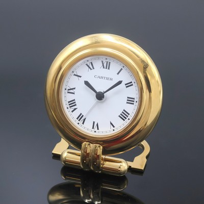 CARTIER Colisee Tischwecker, Schweiz um 1990, quarz, verg. aufstellbares Gehäuse, weißes Zifferbl. m. röm. Zahlen, schwarze Zeiger, Bedienung und ...