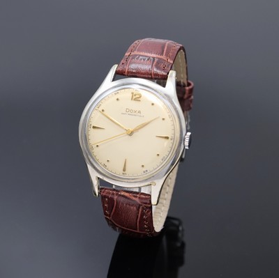 DOXA große Armbanduhr in Stahl, Schweiz um 1965, Handaufzug, Boden aufgedr., silb. Zifferbl. m. gold. Std.-Ind. u. Zeigern, Kal. 1147, D. ca. 38 mm, ...