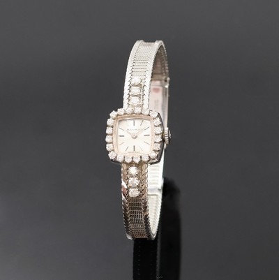 Damenarmbanduhr bezeichnet Movado in WG 750/000 mit Diamanten, Handaufzug, Schweiz um 1970, silb. Zifferbl. m. aufgel. Indizes, Formankerw., 17 St., ...