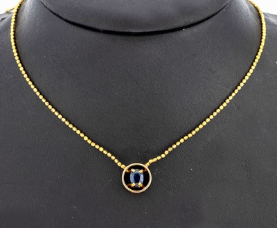 14 kt Gold Saphir-Collier, GG 585/000, Kette aus facett. Goldkügelchen, rundes Mittelteil mit ovalfacett. Saphir ca. 0.60 ct,L. ca. 45 cm, ...