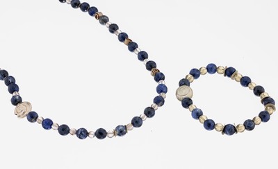 Sodalith-Rauchquarz-Schmuckset, best. aus: 1 Collier, L. ca. 53 cm, facett. Sodalith- undBergkristall-Kugeln, Zwischenglieder und Magnetschließe ...