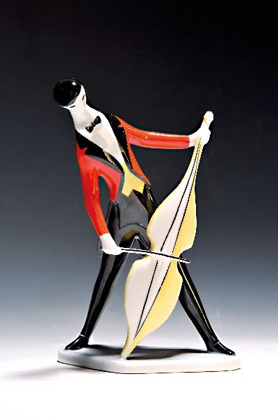 Porzellanfigur, Zsolnay Pecs Ungarn, Entwurf Janos Török (1932-1996), Cellospieler im roten Frack, bunt bemalt, H. ca. 21.5cm