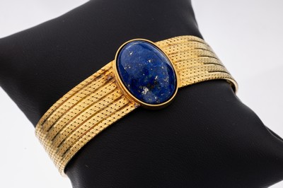 18 kt Gold Lapislazuli-Armband, GG 750/000,Mittelteil bes. mit ovalem Lapislazuli- cabochon, Klappschließe, längenverstellbar, L.ca. 16.5-18.5 cm, ...