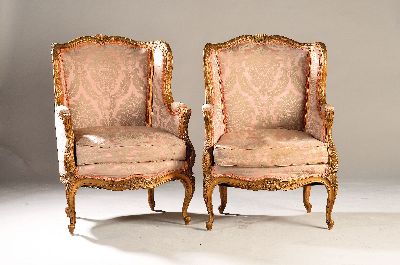 2 Sessel, Frankreich, 2. Hälfte 19. Jh., Buche massiv, aufwendig geschnitzt und goldfarben gefaßt, H. ca. 105 cm, Sh. ca. 49 cm, EZ 2-3