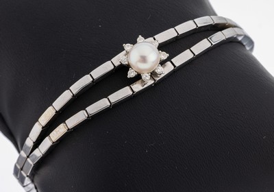 14 kt Gold Perl-Brillant-Armband, WG 585/000, 1 Zuchtperle, D. ca. 7.3 mm, umgeben von 8 Brillanten zus. ca. 0.16 ct Weiß/si-p, L. ca. 18.7 cm, ...
