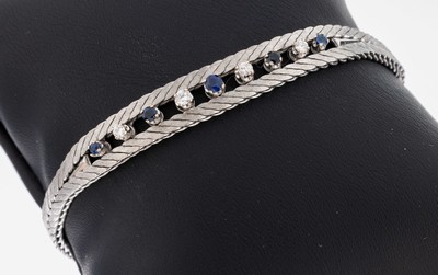 14 kt Gold Brillant-Saphir-Armband, 1970er Jahre, WG 585/000, 4 Brillanten zus. ca. 0.20 ct Weiß/si, 5 rundfacett. Saphire zus. ca. 0.20 ct, L. ca. ...