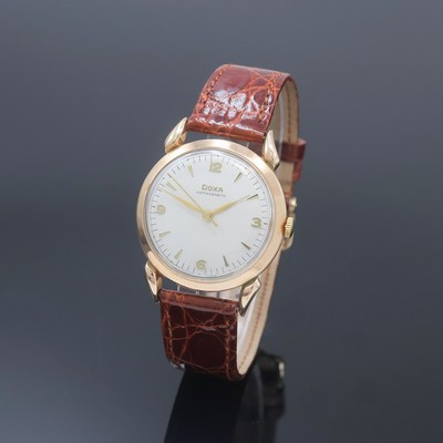 DOXA Armbanduhr in RG 585/000, Schweiz um 1960, Handaufzug, tropfenförm. Anstöße, Boden aufgedr., silb. Zifferbl. m. gold. Std.-Ind. u. Zahlen, ...