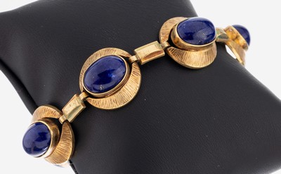 14 kt Gold Lapislazuli-Armband, 1970er Jahre, GG 585/000 gepr., zeittyp. Design, 6 Lapislazuli-Cabochons, L. ca. 19 cm, Kastenschloss mit ...