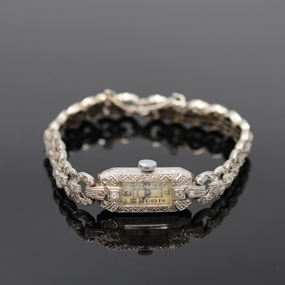 ANCORA Art-Deco Damenarmbanduhr mit Diamanten in WG 750/000, Schweiz um 1925, Handaufzug, Band m. Diamant-Rosen u. Sicherheitskette, Scharnierboden, ...