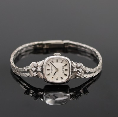 ANKER Damenarmbanduhr mit Diamanten in WG 585/000, Schweiz um 1965, Handaufzug, Goldband teils m. Diamanten bes., Boden aufgedr., silb. Zifferbl. m. ...