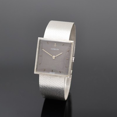 CORUM Armbanduhr in WG 750/000, Schweiz um 1960, Handaufzug, orig. Goldband, Boden aufgedr., graues Zifferbl. m. aufges. Std.- Ind., silb. Zeiger, ...