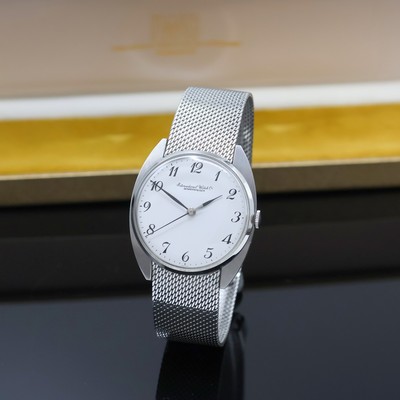 IWC Herrenarmbanduhr in Stahl am angesetzten original Milanaiseband, Schweiz um 1970, 3- teil. Geh., Boden und Glasrand aufgedr., weißes Zifferbl. ...