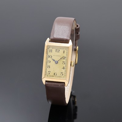 TAVANNES rechteckige Armbanduhr in GG 585/000, Schweiz um 1930, Handaufzug, 2- teil. Scharniergeh., floral grav. Rand, gold. Zifferbl. m. arab. ...