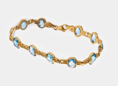 18 kt Gold Topas-Armband, GG 750/000, 11 ovalfacett. Blautopase (beh.) zus. ca. 18.0 ct, L. ca. 19.5 cm, Karabinerschließe, ca. 16.4 g