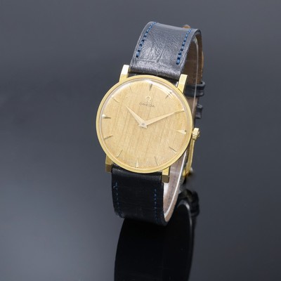 OMEGA Armbanduhr in GG 750/000 Referenz 14372, Schweiz um 1960, Handaufzug, Boden aufgedr., strukt. goldfarb. Zifferbl. m. gold. Std.-Ind. u. Zeiger, ...