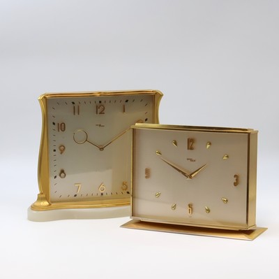 IMHOF 2 hochwertige, vergoldete 8 Tage Tischuhren, Schweiz 1950-1960, 1x Steinsockel, vers. Zifferblätter m. gold. Std.-Ind. u. Zahlen, gold. ...