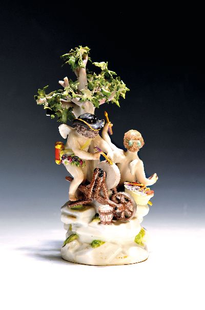 Porzellangruppe, Meissen, 1850-1924, Amoretten am Schleifstein, polychrom bemalt, bestoßen, H. ca. 20.5 cm, Modellnr. E 26
