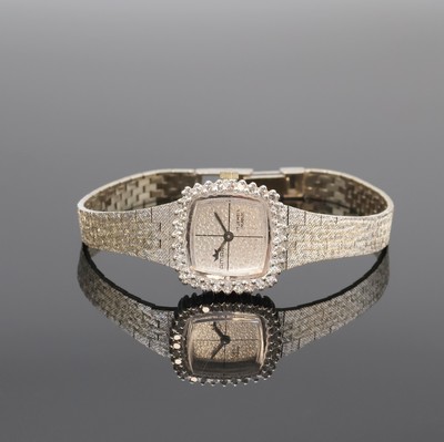 AMARA diamantbesetzte Damenarmbanduhr in WG 585/000, Schweiz um 1970, Handaufzug, 2-tlg. Geh. m. Milanaiseband, Boden aufgedr., silb. ...