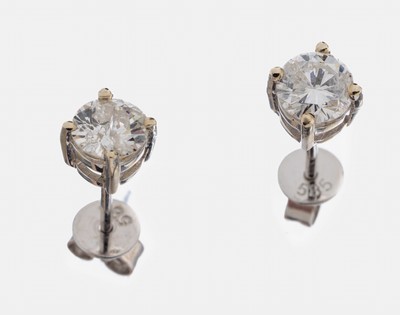 Paar 14 kt Gold Diamant-Ohrstecker, WG 585/000, 1 Brillant und 1 Altschliffdiamant zus. ca. 0.80 ct get.Weiß/p