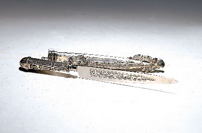 Jagdmesser, 20. Jh., Scheide Silber geprüft, Stahlklinge, Silberscheide reliefiert mit Weidevieh und Eichenlaub, Gesamtl. ca. 31.5cm