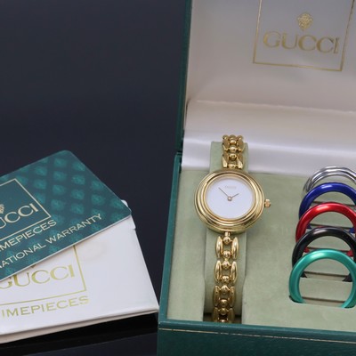 GUCCI vergoldete Damenarmbanduhr mit Wechsel-Lünetten Referenz 11/12.2, Schweiz um 1995, quarz, orig. Band, Lünette verschr., weißes Zifferbl. m. ...