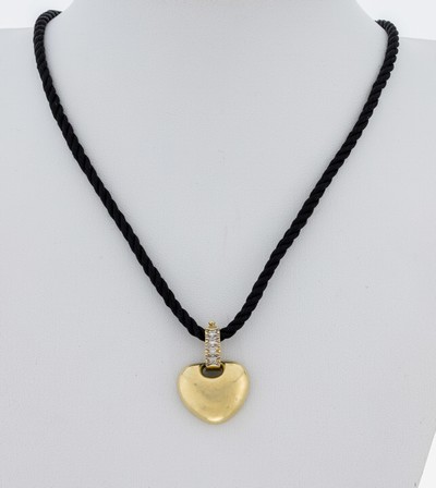 14 kt Gold Diamant-Clipanhänger, GG 585/000, Öse mit 4 Diamanten zus. ca. 0.08 ct Weiß/si, an schwarzem gekordeltem Seidencollier, ...