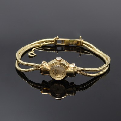 BRAUN Damenarmbanduhr in GG 585/000, Schweiz um 1955, Handaufzug, 2-teil. Geh., Scharnierboden, silb. Zifferbl. pat., gold. Indizes und Zeiger, ...