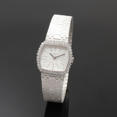 IWC seltene Damenarmbanduhr in WG 750/000 mit Diamantlünette, Handaufzug, Schweiz um 1970, 2-teil., massives Goldgeh. inkl. orig. Band, Lünette ...