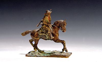 Bronzefigur, um 1900, Cowboy auf Pferd, unsigniert, ca., 9 x 10 cm, Reste von Fassung