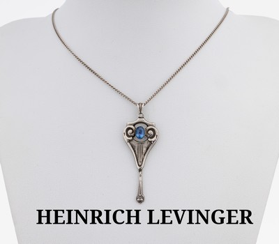 HEINRICH LEVINGER Anhänger, um 1910, 800er Silber, feiner Jugendstilentwurf, symmetrischeGestaltung mit Voluten, schlanke nach unten gezogene Form ...