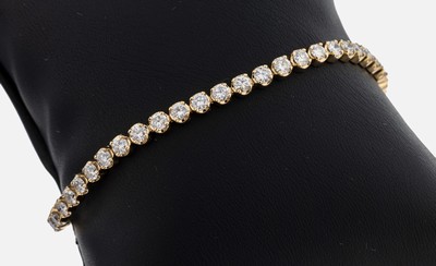 14 kt Gold Brillant-Linienarmband, GG 585/000, Brillanten zus. ca. 5.0 ct feines Weiß-l.get.Weiß/vs-p, L. ca. 18.5 cm, Kastenschloss mit ...