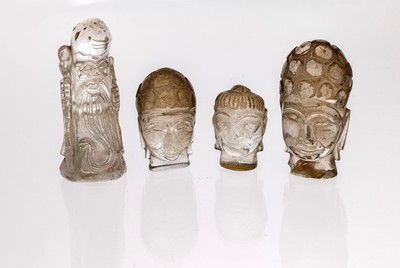 Lot 4 Bergkristall-Schnitzereien, Idar- Oberstein, um 1920-40, Darstellung von Buddha-Köpfen in versch. Größen, 1 x L. 3.5 cm, 1 x L. ca. 4.3 cm, ...