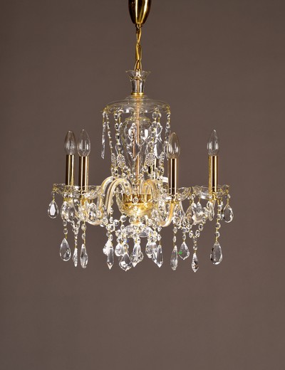 Deckenlüster, 20.Jh., 5 Brennstellen, mit aufwendigem Kristallbehang, Elektrifizierung nicht geprüft, H. ca. 71 cm, D. ca. 47 cm
