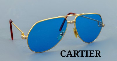 CARTIER Sonnenbrille, Modell Santos, Metallverg., blaue Gläser, Bügellänge 130, schildpattfarb. Bügelenden, sign.