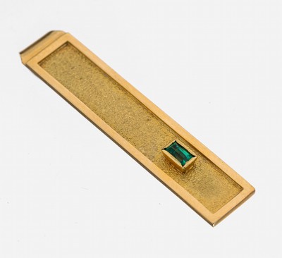 18 kt Gold Smaragd-Krawattenklammer, GG 750/000, Oberfläche part. strukt., Smaragd- Baguette 0.10 ct, schöne Farbe, ca. 7.5 g