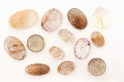 Lot 13 lose Rutilquarz Cabochons, zus. 133.98 ct, oval, in versch. Größen