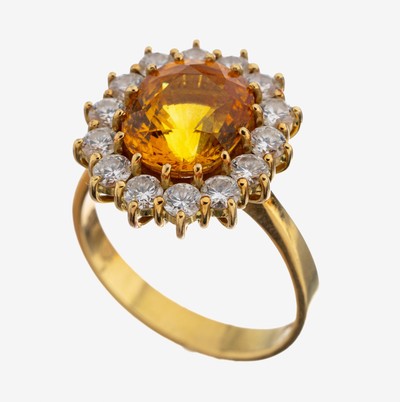 18 kt Gold Saphir-Brillant-Ring, GG 750/000, mittig ovalfacett. orangefarb. Saphirca. 5.0 ct, 14 Brillanten zus. ca. 1.0 ct feines Weiß/lp, RW 57, ...