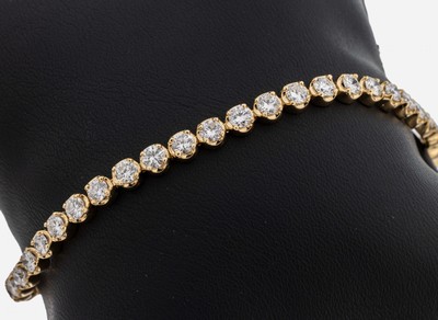 14 kt Gold Brillant-Linienarmband, GG 585/000, 42 Brillanten zus. ca. 5.60 ct feinesWeiß-Weiß/vs-si, L. ca. 18.5 cm, Kastenschlossmit 2 ...