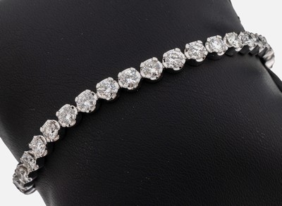 14 kt Gold Brillant-Linienarmband, WG 585/000, 35 Brillanten zus. ca. 8.50 ct feinesWeiß-l.get.Weiß/vs-si, 1 Stein besch., L. ca. 18.5 cm, ...